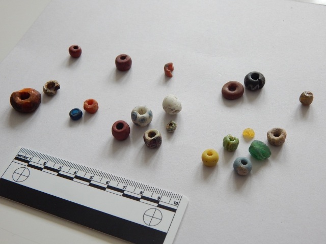 Glass beads and amber beads from Viking Age Denmark.